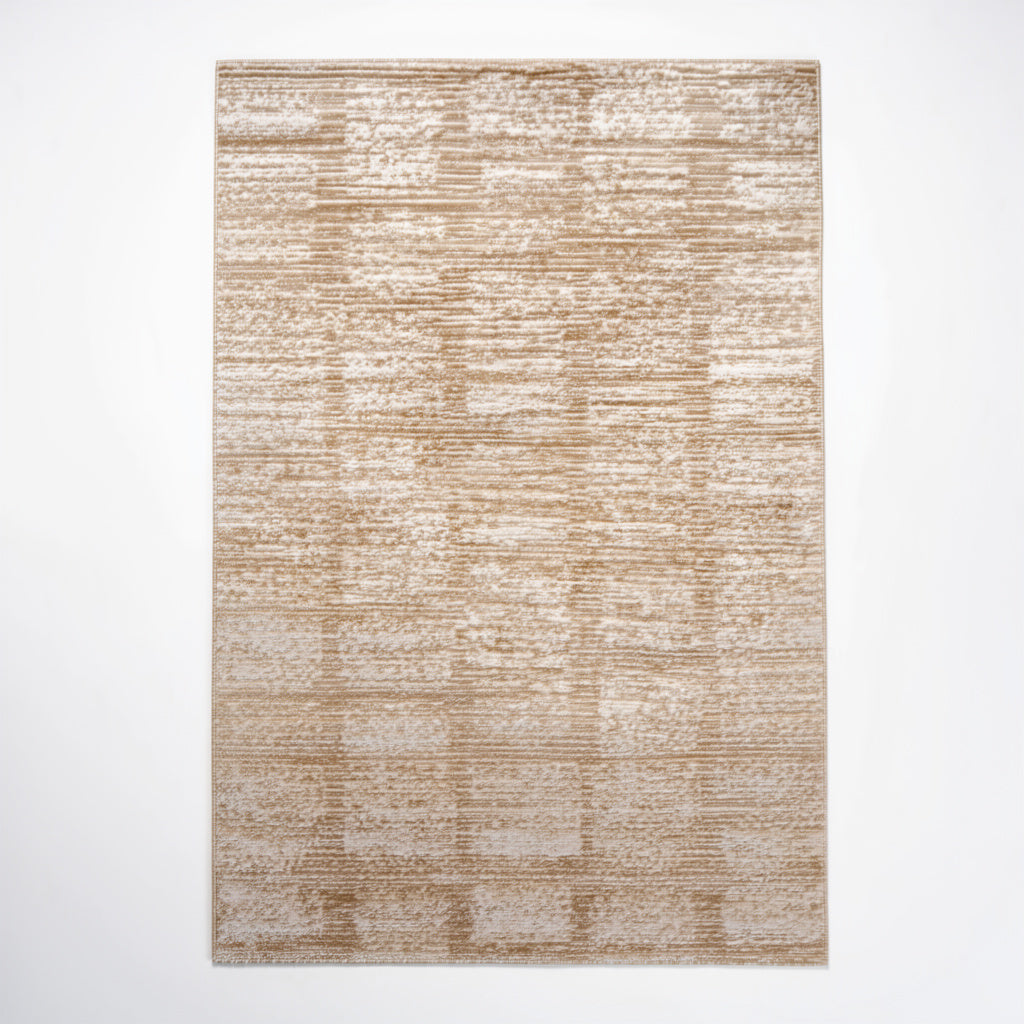 Beige and cream textured area rug with abstract rectangular pattern on white background