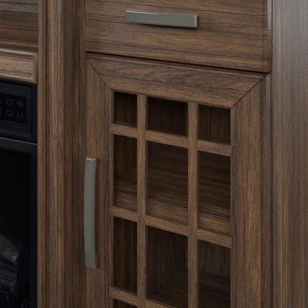 Close-up of dark wood kitchen cabinet with glass paneled door and silver handles