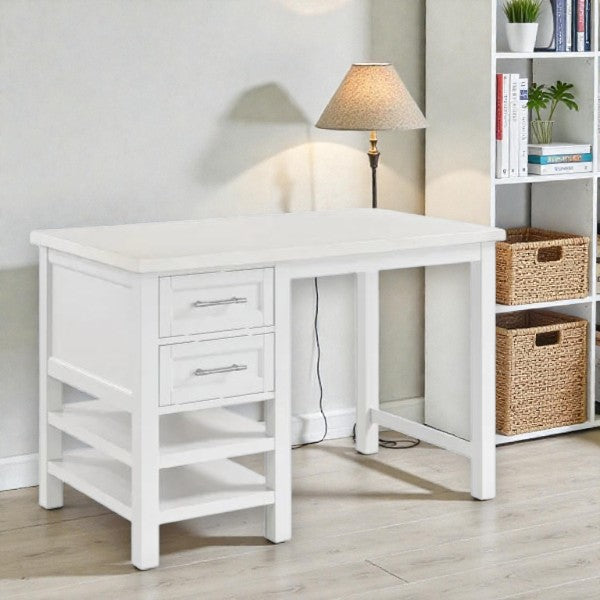 White wooden desk with two drawers and side shelves in a modern room with lamp and bookshelf