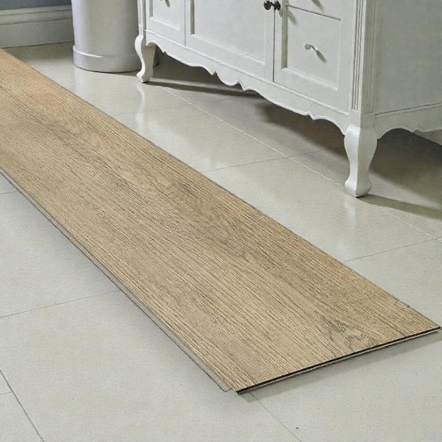 Light wood vinyl plank flooring sample placed on beige tile floor near white vintage cabinet