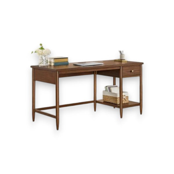 Mid-century modern wooden desk with single drawer, lower shelf, laptop, books, and vase with flowers