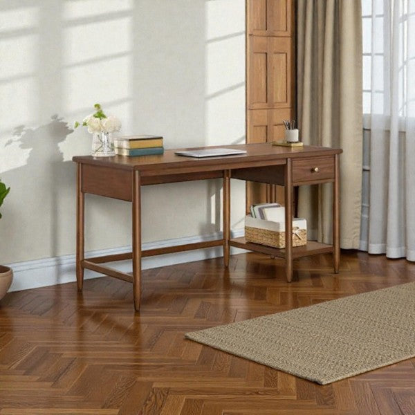 wooden desk with single drawer, decorative books, flower vase, and basket on herringbone wood floor
