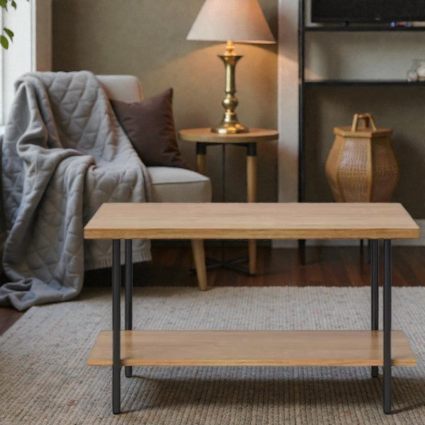 Modern living room with wooden coffee table, cozy armchair with gray throw, brass lamp, and woven lantern