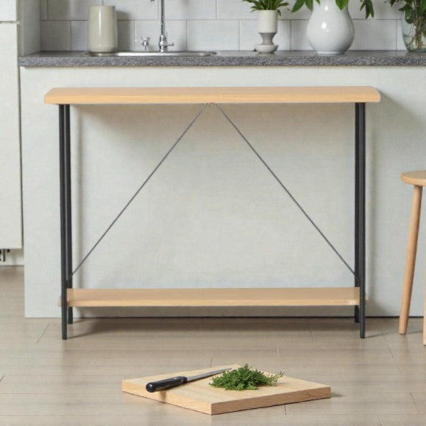Minimalist kitchen with wooden console table and herbs on cutting board with knife