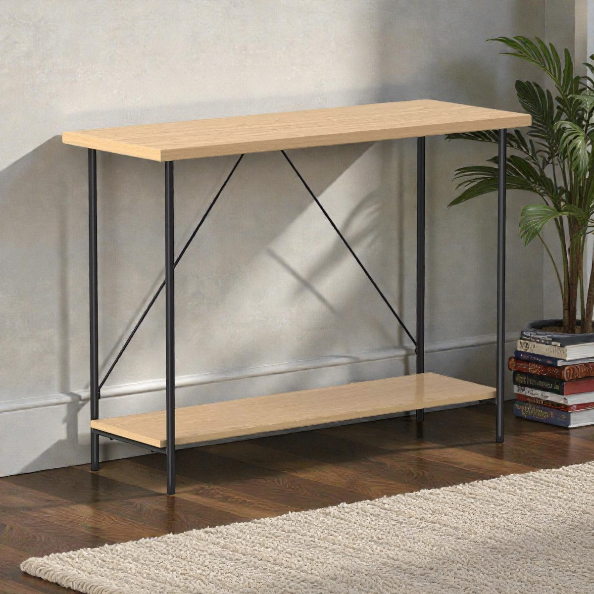 Modern console table with light wood shelves and black metal frame against beige wall